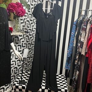 #42 R&M Richard’s Ruffle sleeveless top with silver sparkle design romper